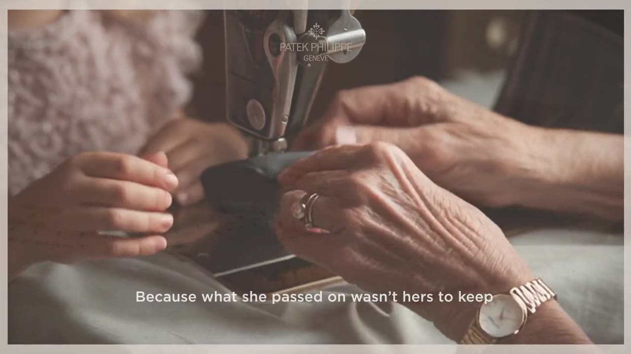 Two pairs of hands around the watch, a childhood photograph between them.